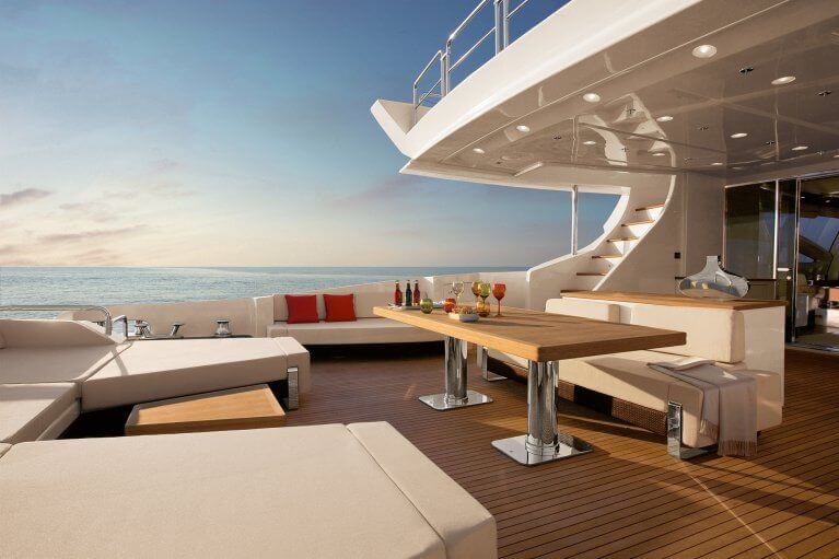 Aft deck with large table on a luxury yacht cruising in Aegean sea